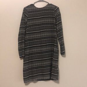 Black and white patterned, above the knee dress